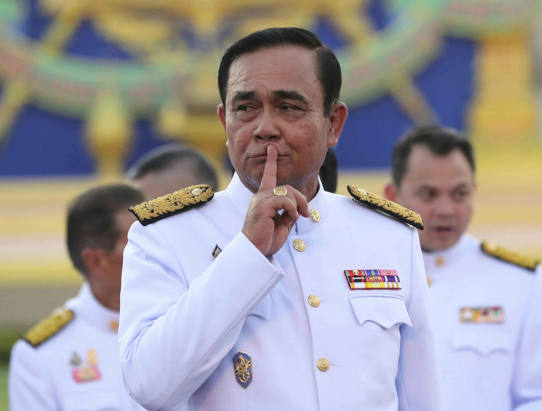 Thailand's Prime Minister Prayuth Chan-ocha reacts after a group photo with his cabinet members at the government house in Bangkok Tuesday, July 16, 2019. Prayuth on Tuesday led his 36 cabinet members to take their oath in front Thailand's King Maha Vajiralongkorn. (AP Photo/Sakchai Lalit)