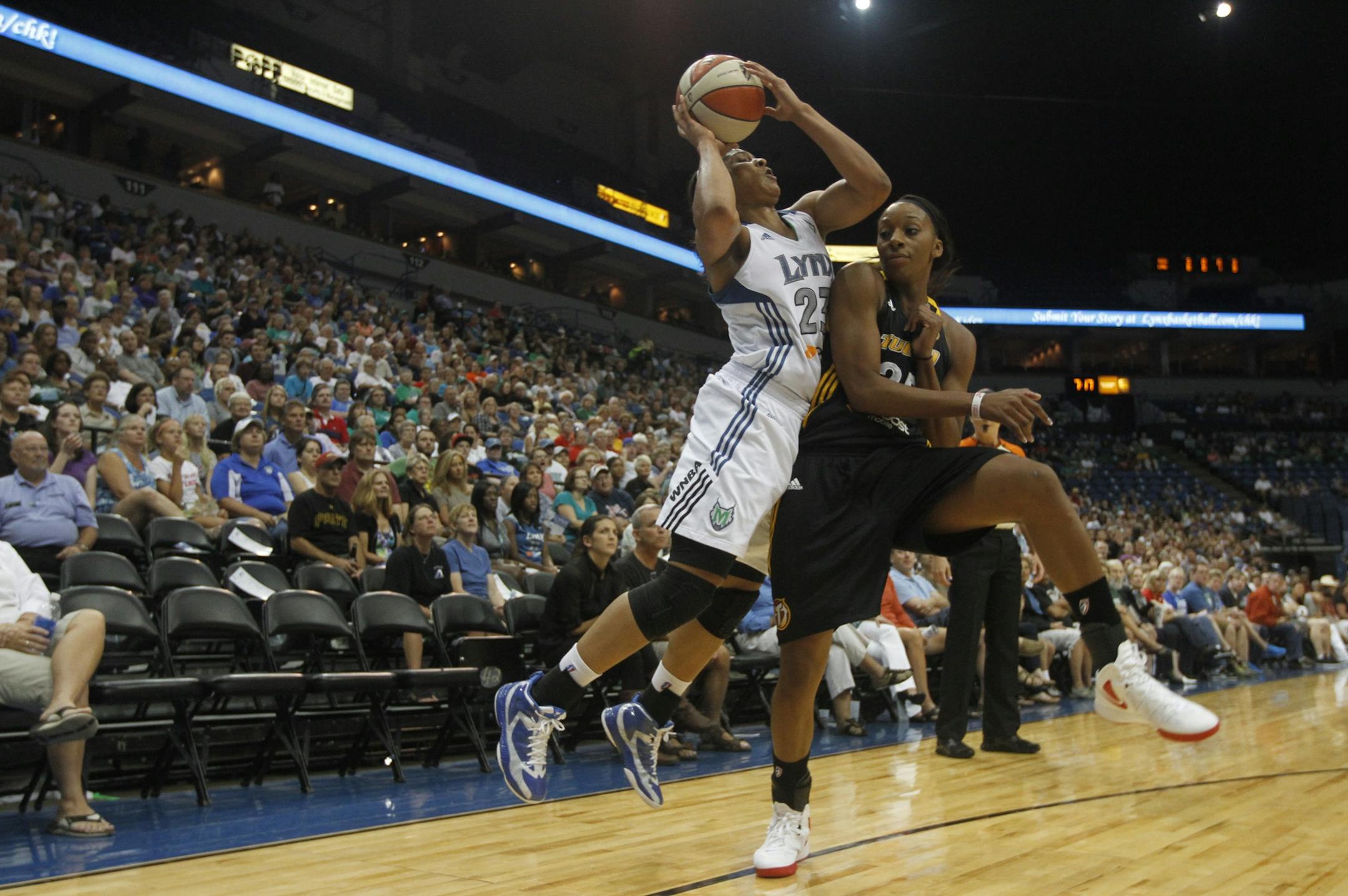 Lynx Maya Moore was fouled by the Shock's Glory Johnson during first half action at the Target Center in Minneapolis, Min., Friday August 31, 2012.