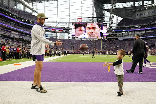 Minnesota Vikings wide receiver Adam Thielen (19) played catch with his son Asher on the field ahead of Sunday's game. ] ANTHONY SOUFFLE &#x2022; anth