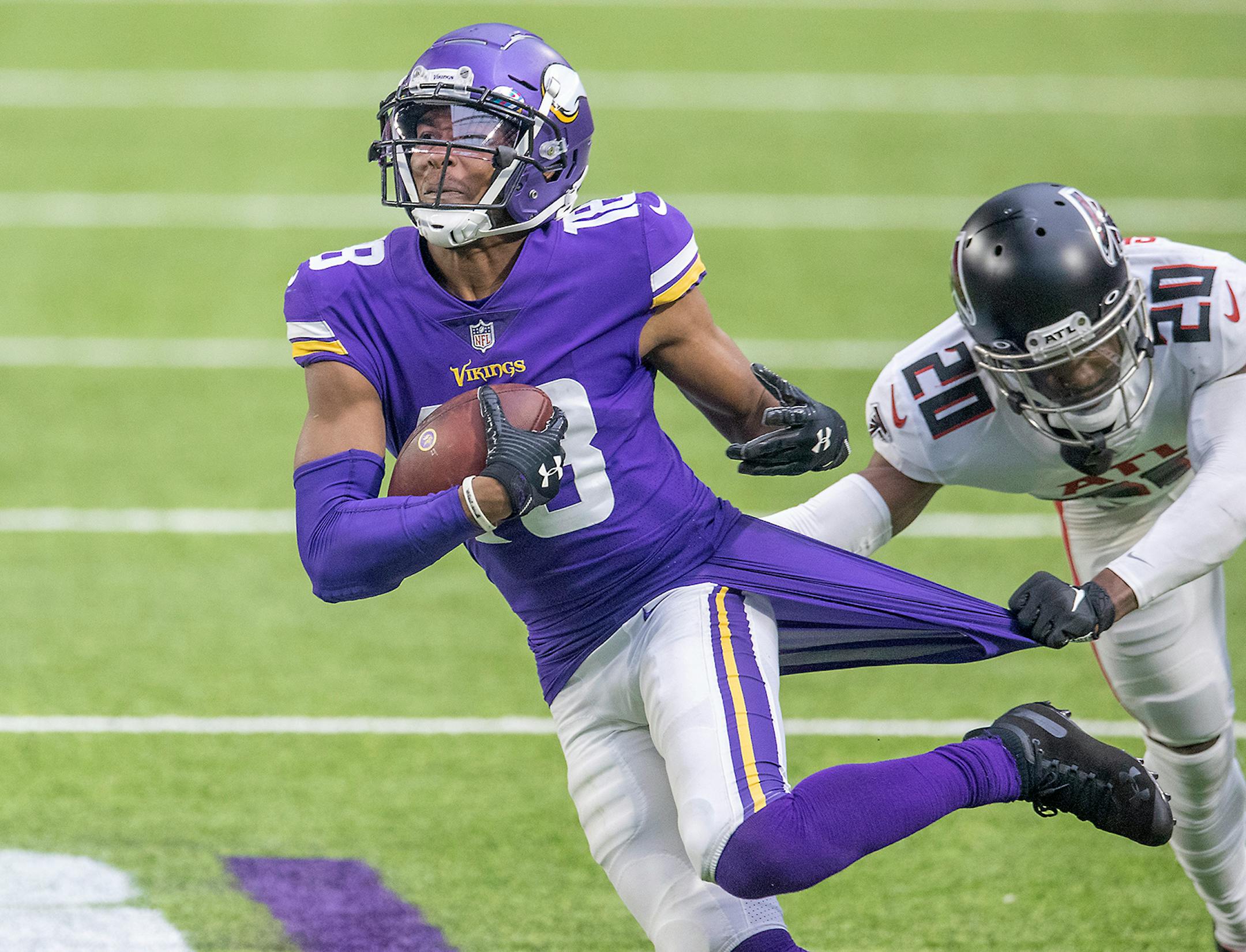 Minnesota Vikings wide receiver Justin Jefferson broke away from Atlanta Falcons defensive back Kendall Sheffield's grasp to run it in for a touchdown during the fourth quarter.