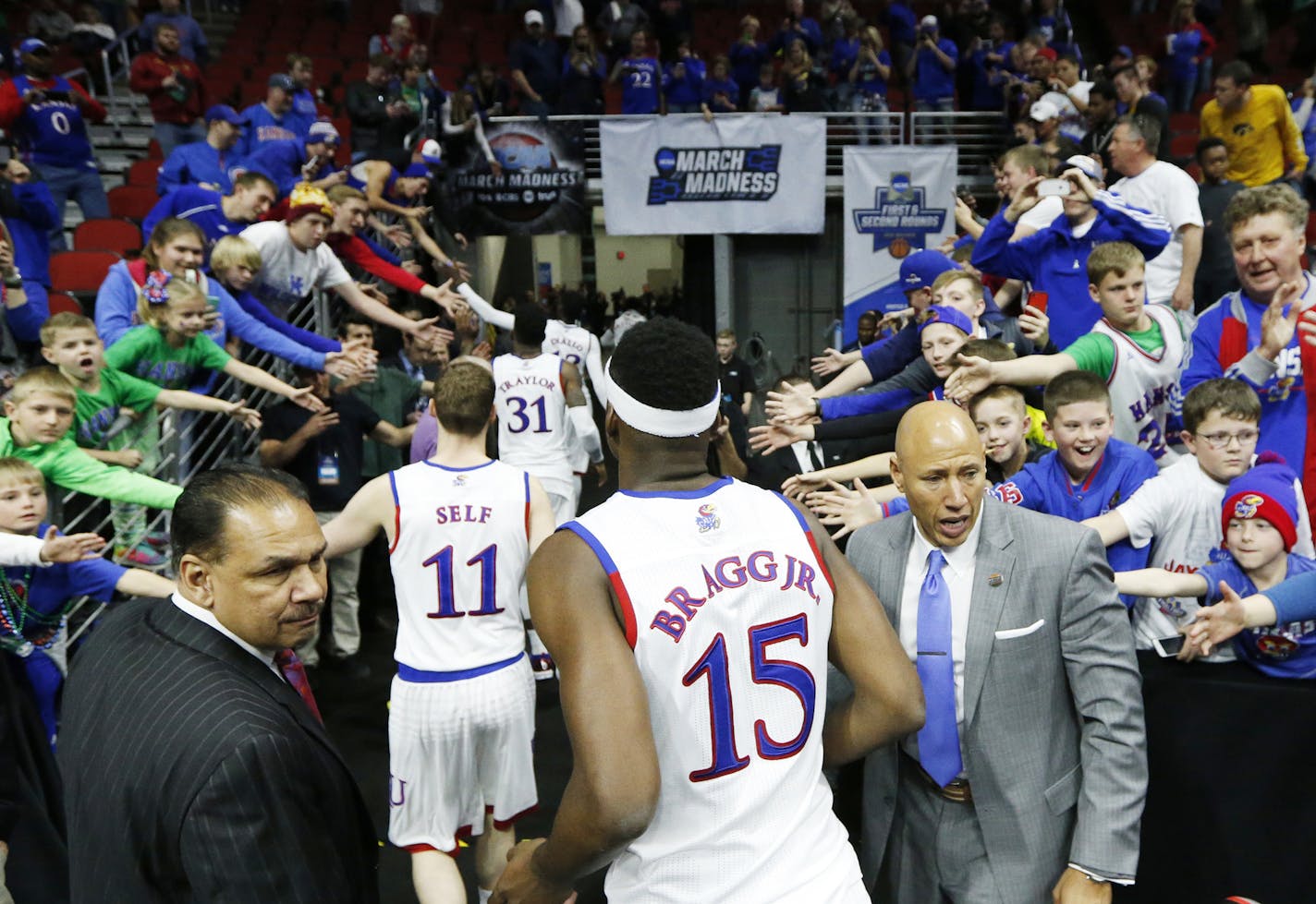 Kansas players head to the locker room after the Jayhawks defeated Austin Peay, 105-79, on Thursday, March 17, 2016, in the first round of the NCAA Tournament at Wells Fargo Arena in Des Moines, Iowa. (Bo Rader/Wichita Eagle/TNS)