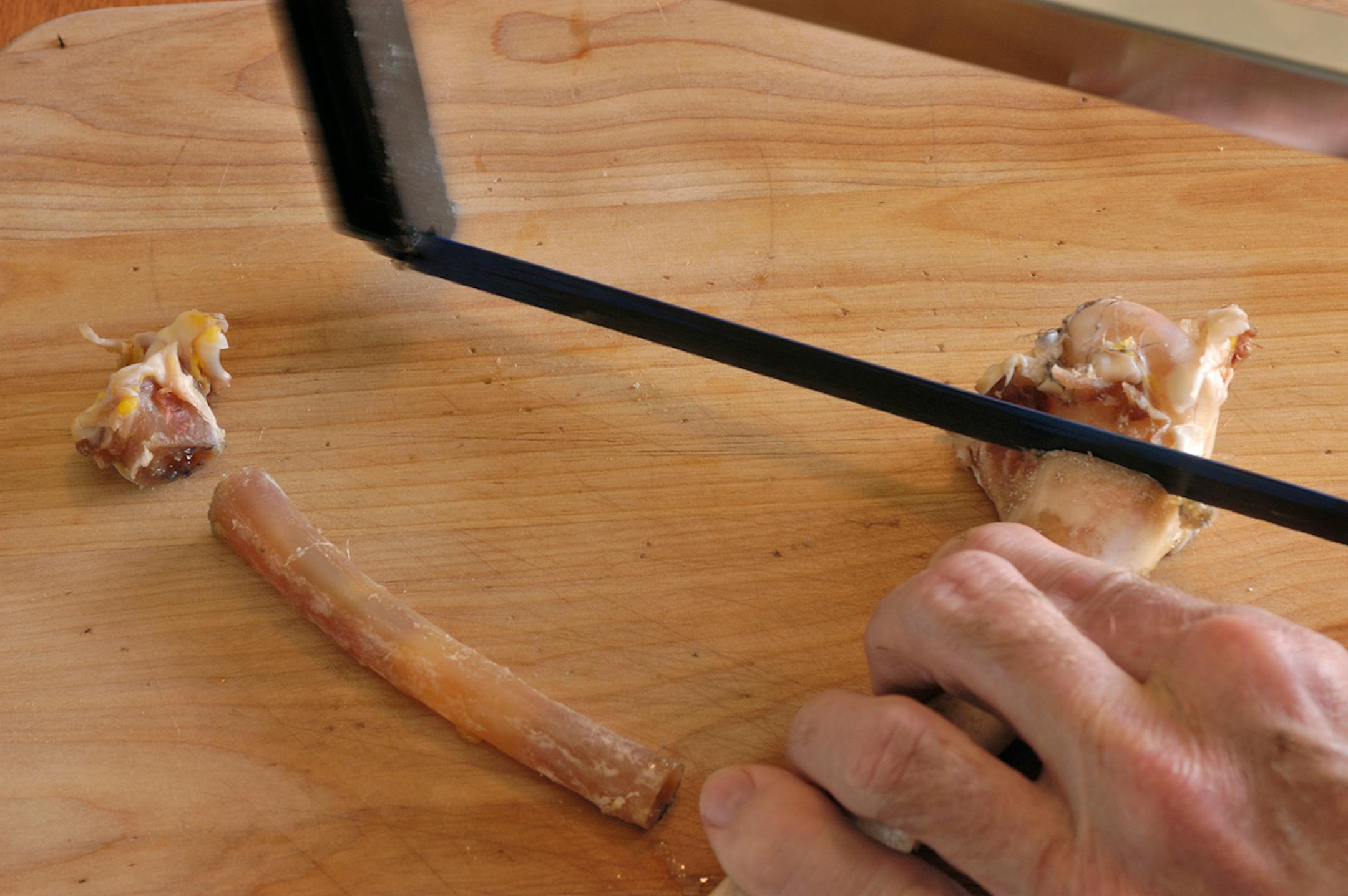 Use a hack saw to remove the large knobby end from each bone.