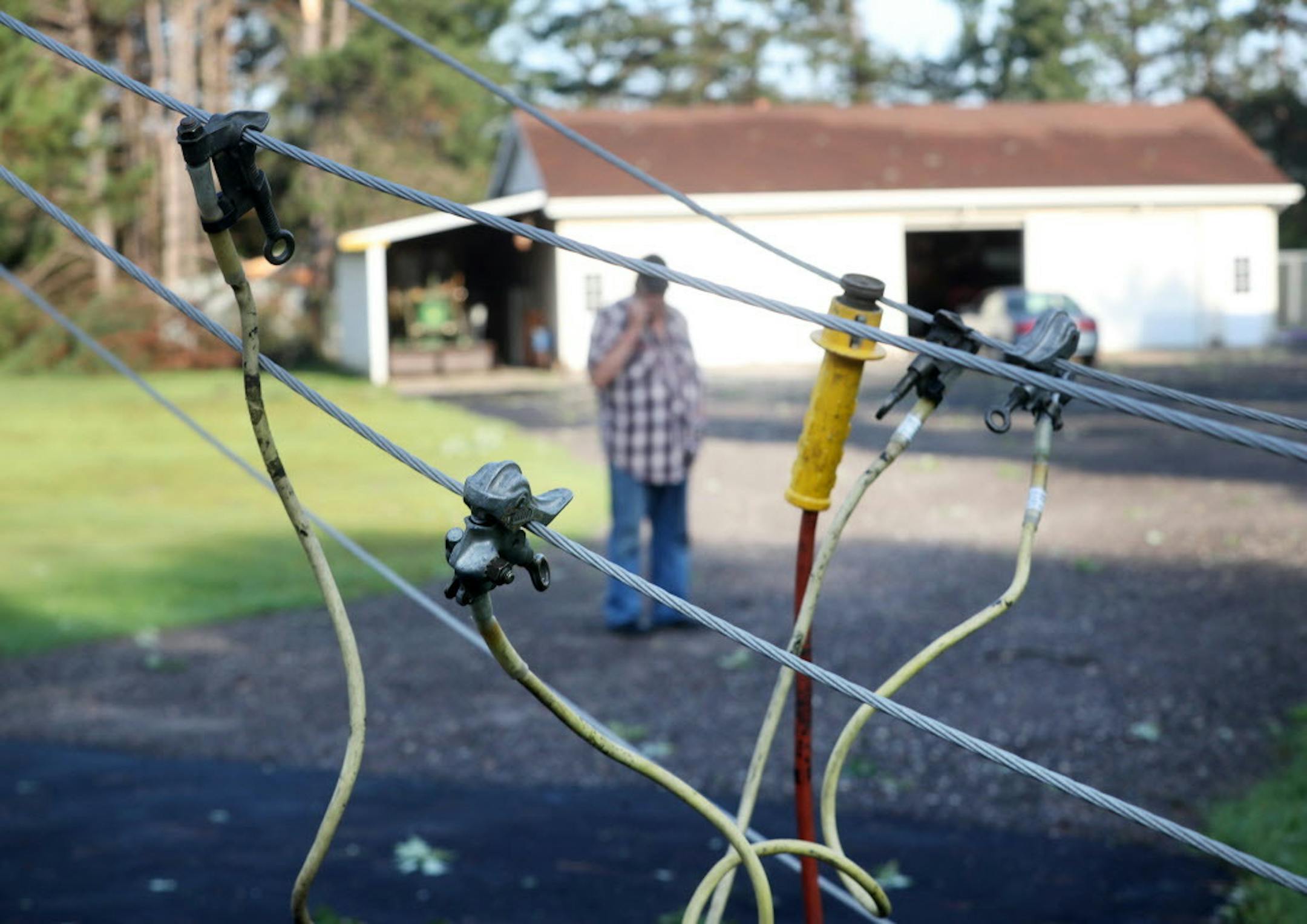 A strong early morning thunderstorm packing powerful winds downed trees and power lines along 24702 Kettle River Blvd., on the Boyd and Judy Bontjes property, south of Wyoming, Minn.