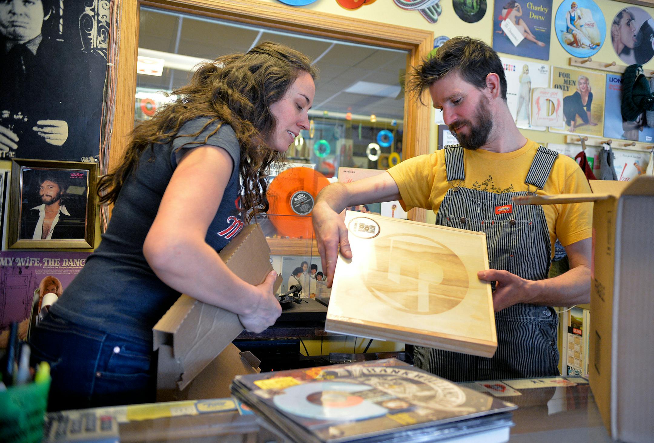 Hymie's Vintage Records owners Laura and Dave Hoenack unpack special limited edition Record Store Day releases in preparation for Hymie's Record Store Day Block Party. ] (SPECIAL TO THE STAR TRIBUNE/BRE McGEE) **Laura Hoenack (left, owner), Dave Hoenack (right, owner)