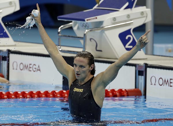 Hungary's Katinka Hosszu celebrates breaking the world record and winning the gold medal in the women's 400-meter individual medley during the swimmin