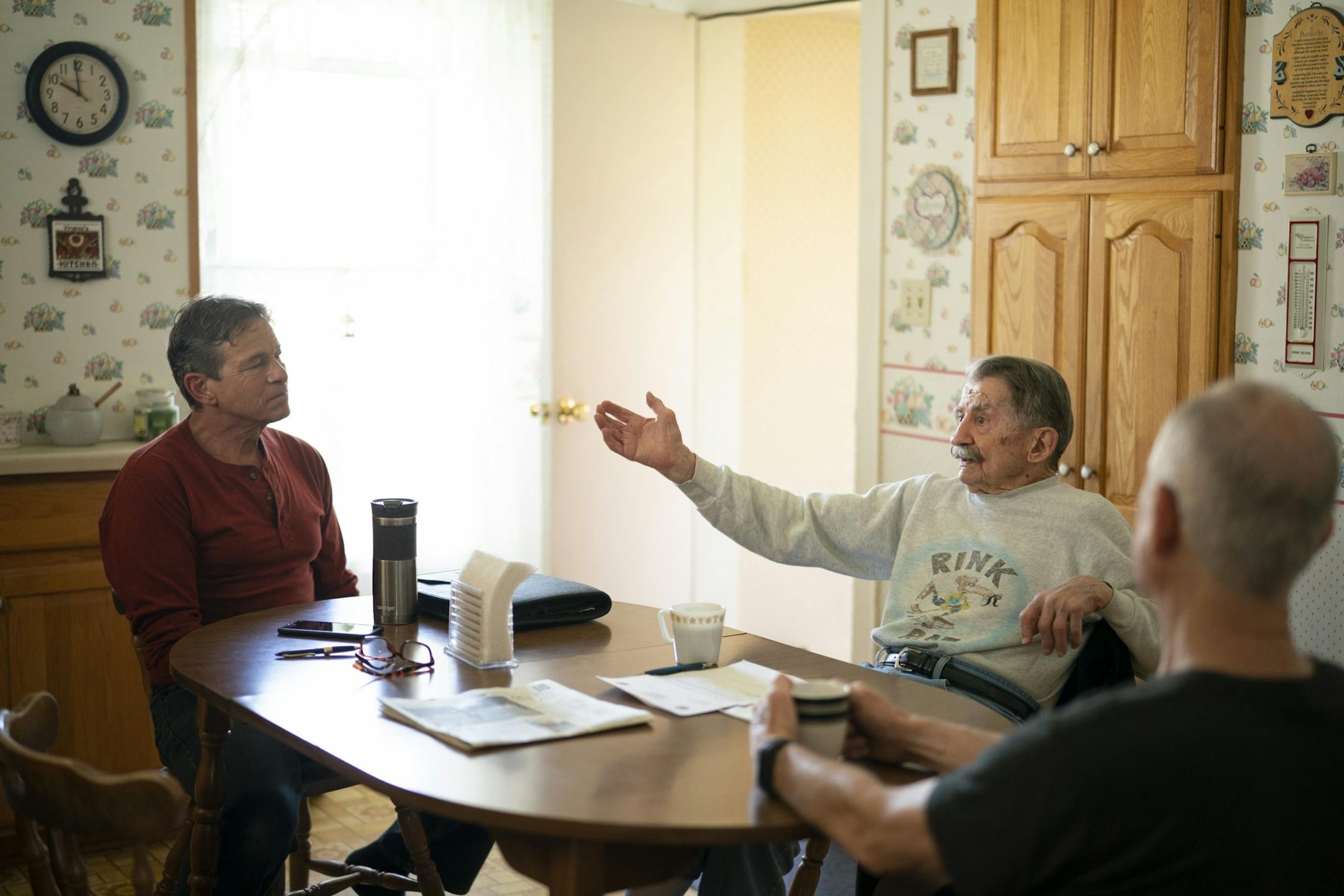 After most morning hockey games, buddies come over to Mark Sertich's house for coffee and conversation. After Thursday's game, Dane Youngblom, left, and Bob Somers stopped by.