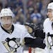 Pittsburgh Penguins Sidney Crosby, right, is congratulated by teammate Patric Hornqvist after scoring against the Toronto Maple Leafs during the first