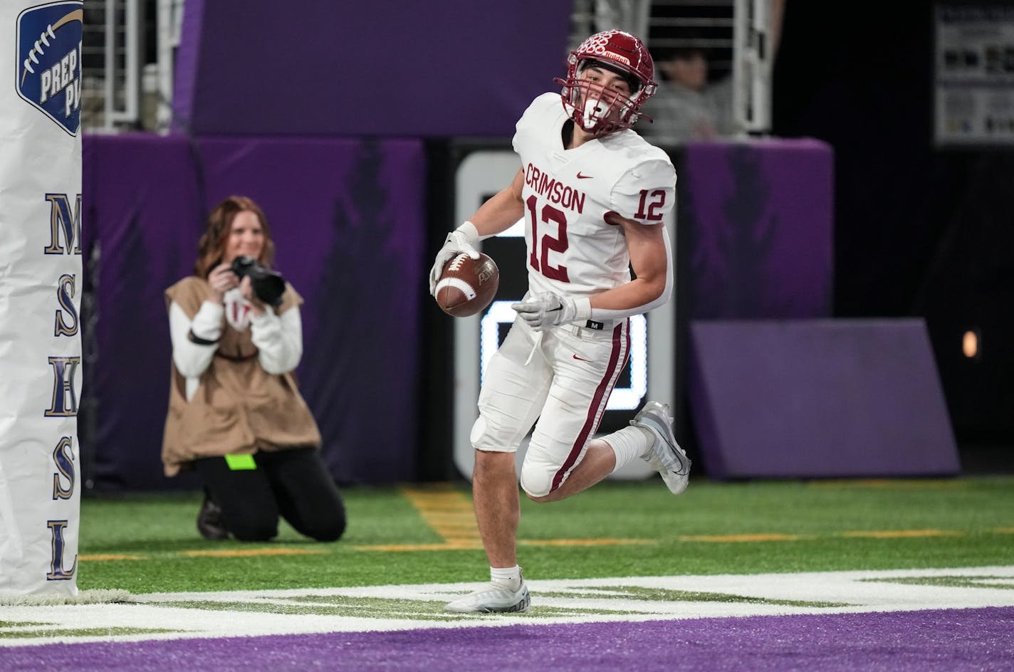 Maple Grove Crimson wide receiver Jacob Anderson (12) scores a touchdown in the first half. Rosemount Irish played the Maple Grove Crimson in the Class 6A championship game on Friday, Dec. 2, 2022 at U.S. Bank Stadium in Minneapolis, Minn. ] RENEE JONES SCHNEIDER • renee.jones@startribune.com