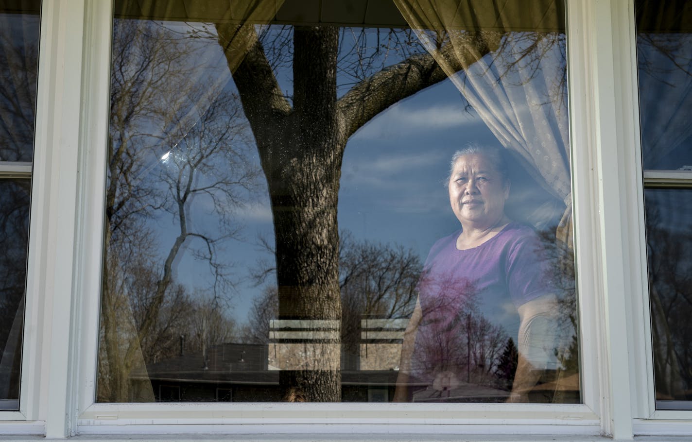 May Vang got help replacing her lead windows through Hennepin County last November. She stood in her picture window in Minneapolis, Minn., on Tuesday, April 23, 2019. ] RENEE JONES SCHNEIDER &#x2022; renee.jones@startribune.com