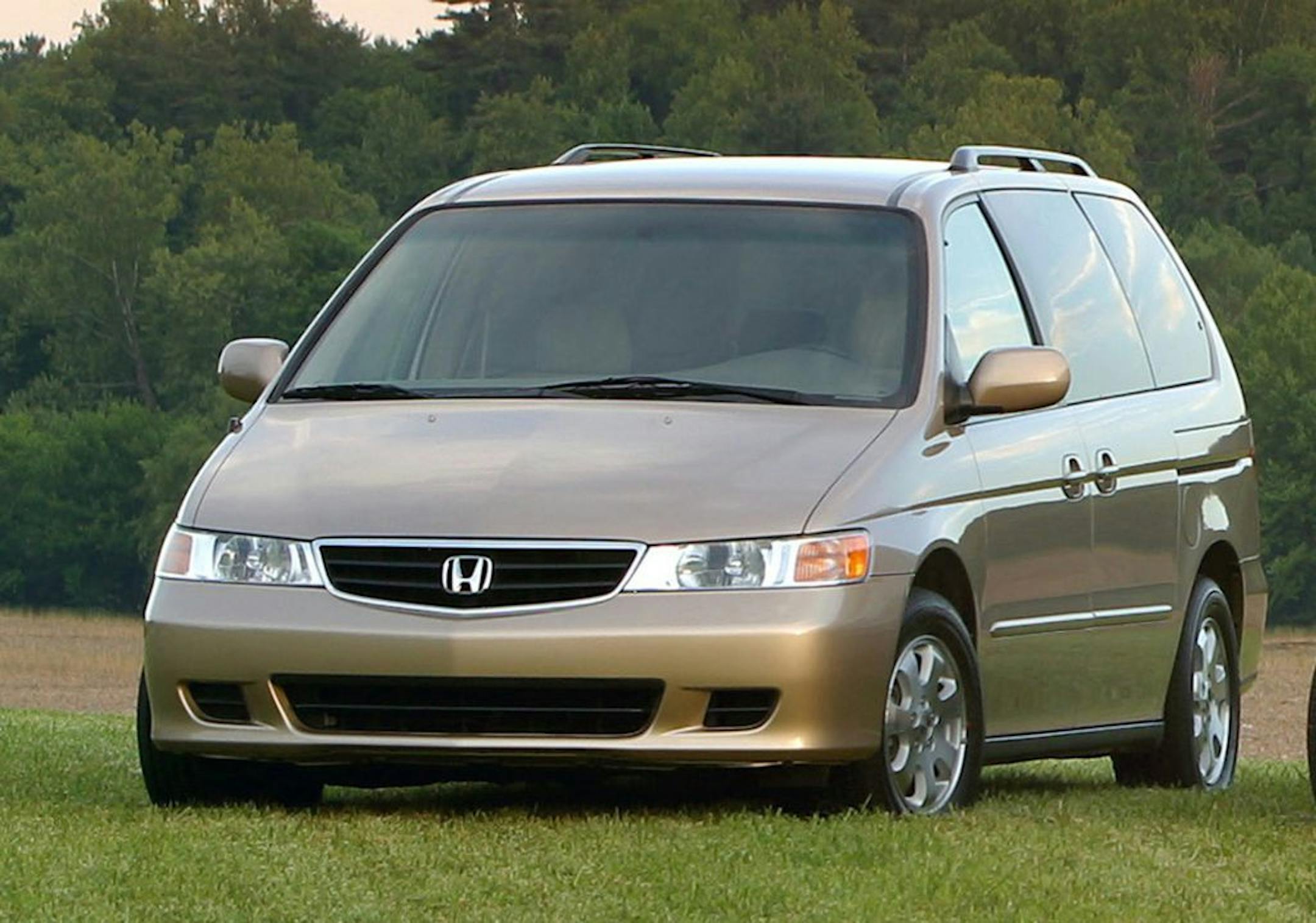 FILE - A 2003 Honda Odyssey is shown in an undated Honda Motor Company file photo. U.S. safety regulators have added about 320,000 older model Honda Odyssey minivans to a widening probe of faulty air bags that affects at least three automakers and more than 2 million vehicles. Front air bags on the Honda Motor Co. minivans from the 2003 and 2004 model years can inflate without a crash, possibly injuring drivers and passengers.