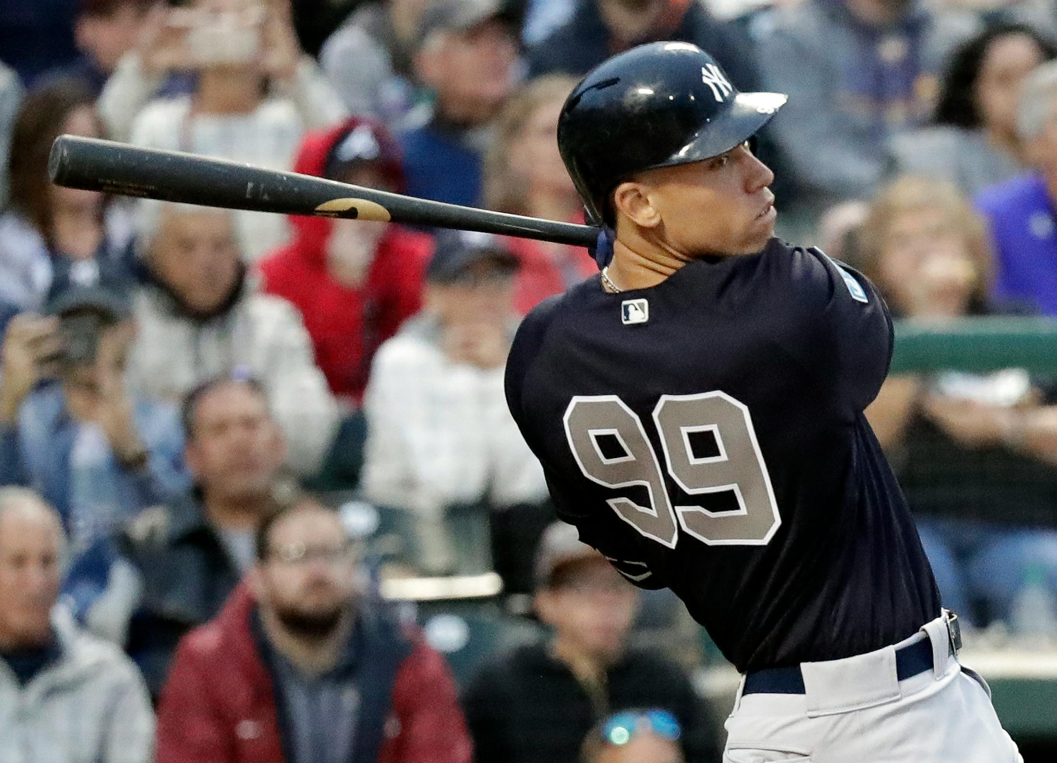 New York Yankees' Aaron Judge hits a triple to drive in two runs in fifth inning of a spring baseball exhibition game against the Atlanta Braves, Monday, March 18, 2019, in Kissimmee, Fla. (AP Photo/John Raoux)