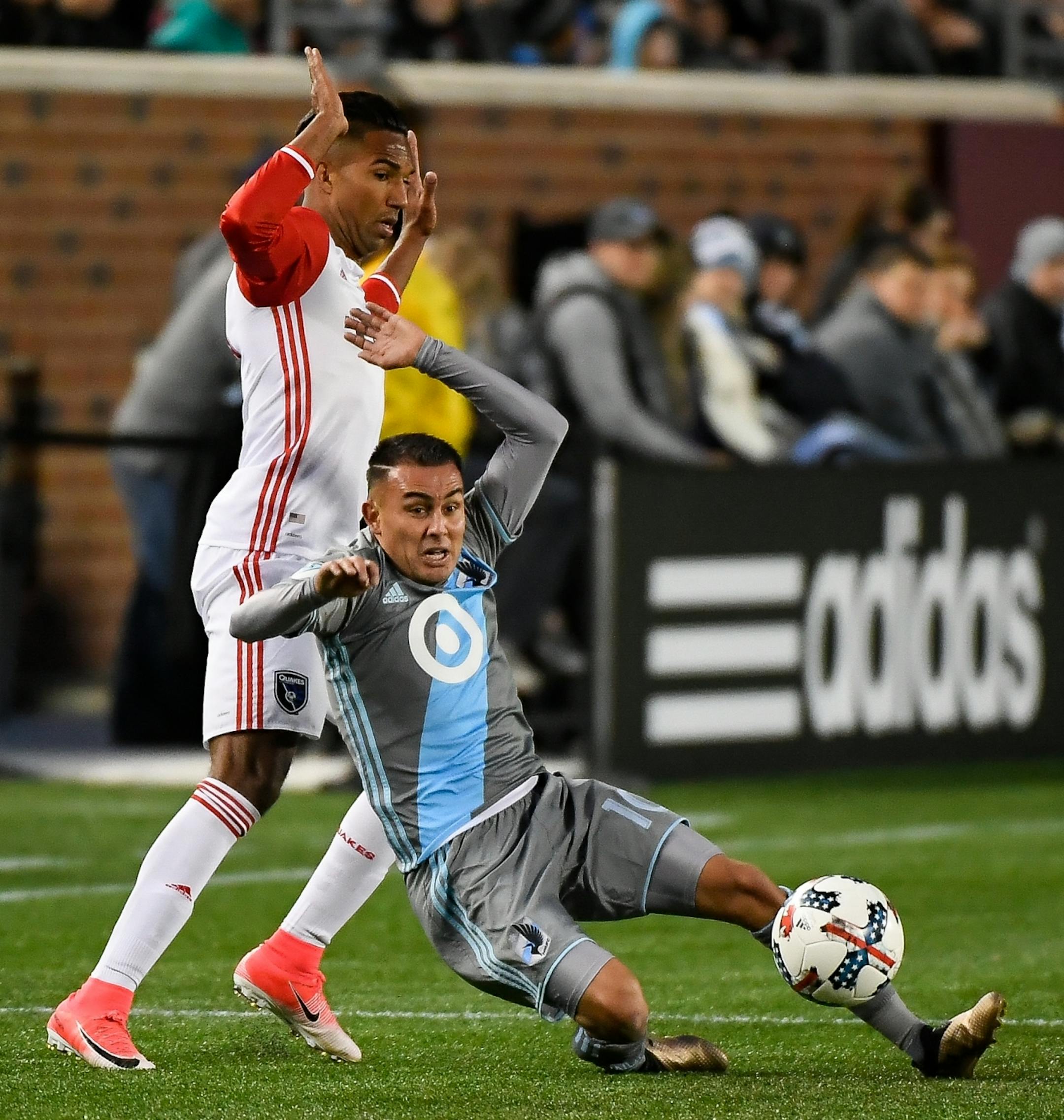 Minnesota United midfielder Miguel Ibarra (10) slid after the ball down to the turf while being challenged by San Jose Earthquakes forward Danny Hoesen (9) in the second half.