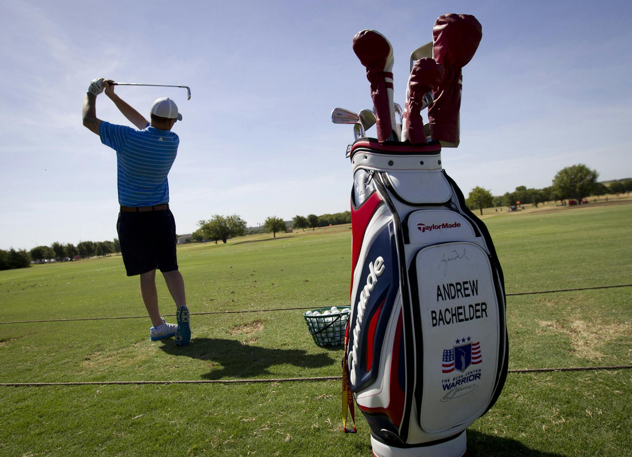 Andrew Bachelder practices at Leonard Golf Links in Fort Worth, Texas, on Monday, Aug. 10, 2015. Bachelder is still recovering from a mid-air helicopter collision in Afghanistan that left him with many broken bones. He will play golf with former President George W. Bush in his annual Warrior Open tournament for military members seriously injured since Sept. 11, 2001. (Joyce Marshall/Fort Worth Star-Telegram/TNS)
