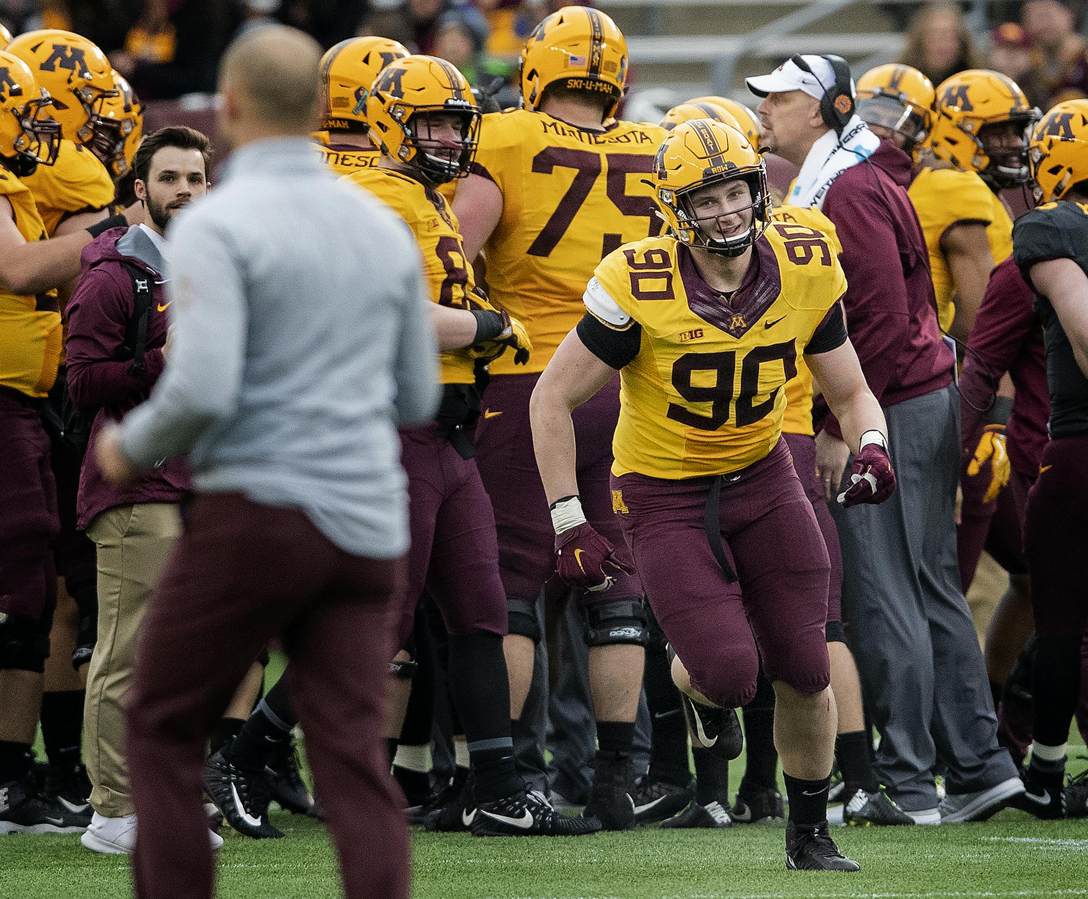 Sam Renner (90) ran to Gophers head coach P.J. Fleck after learning he won a scholarship during the spring game. ] CARLOS GONZALEZ &#x2022; cgonzalez@startribune.com &#x2013; April 12, 2018, Minneapolis, MN, TCF Bank Stadium, University of Minnesota Gophers Football Spring Game.