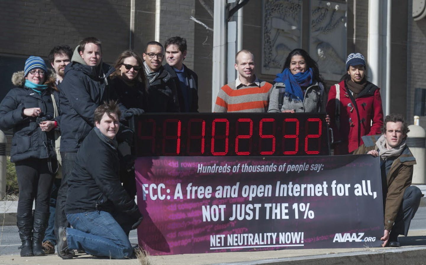 IMAGE DISTRIBUTED FOR AVAAZ - Avaaz joins with other US advocacy groups to deliver more than a million signatures for a free and democratic internet to the FCC in Washington using a giant digital counter on Thursday, Jan. 30, 2014. (Kevin Wolf/AP Images for Avaaz)