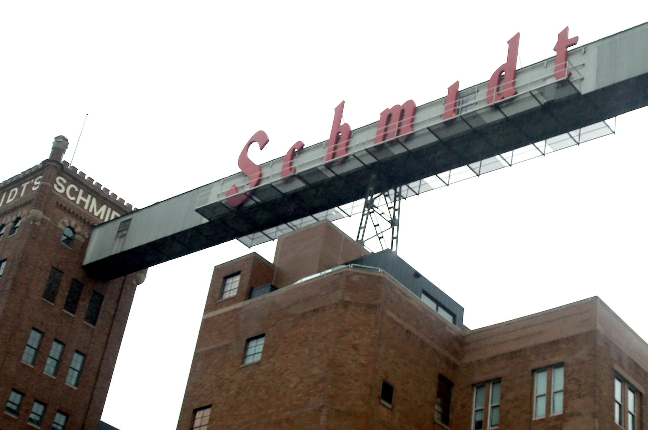 The old Schmidt brewery in St. Paul ] JOELKOYAMA‚Ä¢jkoyama@startribune St. Paul, MN on June 19, 2014. Less than two years after a Plymouth developer bought the property, the old Schmidt brewery in St. Paul has been transformed into a nearly fully booked artists housing complex that promises to infuse new life in the W. 7th area. The icing on the cake is the return of the iconic Schmidt sign, a full-scale replica of which has been installed and will be lit for the first time Satu