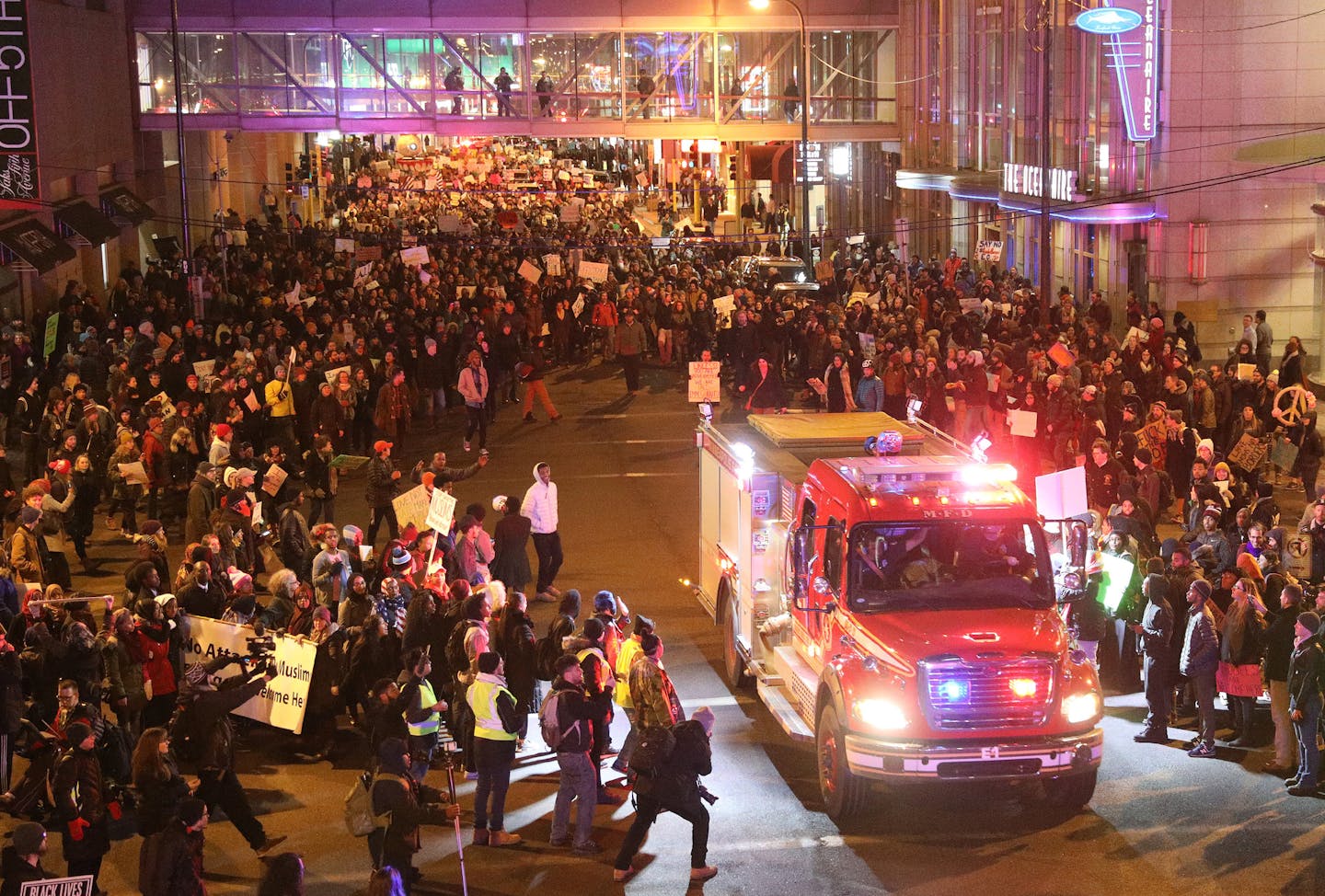 Protesters cleared a way for an emergency vehicle as they marched against President Trump's temporary immigration ban on seven predominantly Muslim countries Tuesday. ] ANTHONY SOUFFLE &#x2022; anthony.souffle@startribune.com Protesters rallied against President Donald Trump's temporary immigration ban on seven predominantly Muslim countries Tuesday, Jan. 31, 2017 at the Warren E. Burger Federal Building & United States Courthouse in Minneapolis.