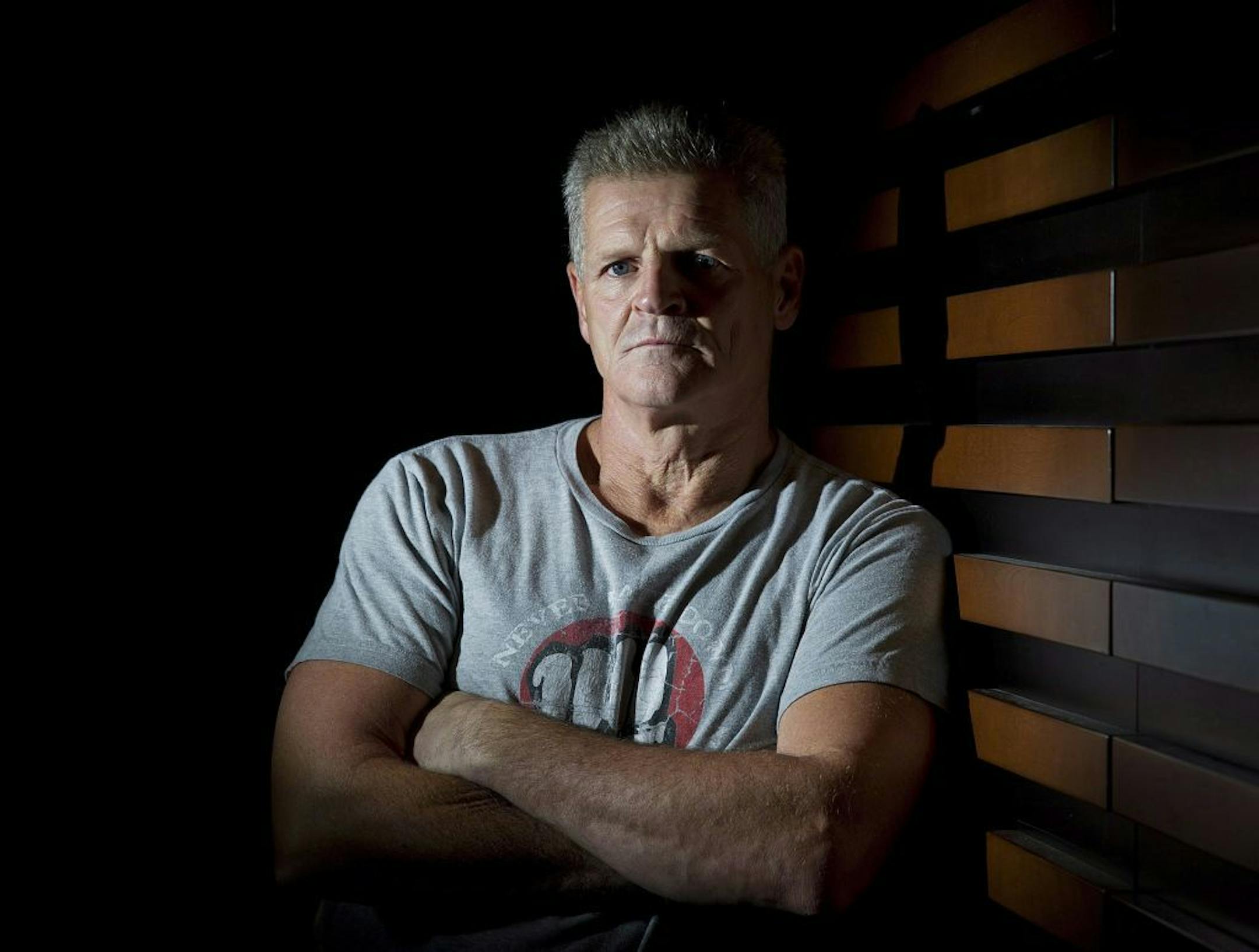 FILE - In this Oct. 24, 2012, file photo former NHL tough guy Chris Nilan poses for a portrait while promoting the documentary "The Last Gladiators," in Toronto. Nilan had a far greater fight than one on the ice. He battled herioin and alcohol addiction long after his career as one of the NHL's top brawlers. His life is documented in the upcoming documentary "The Last Gladiators."