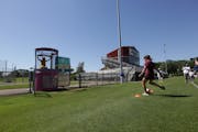 Former Gophers soccer player Maddie Castro shot to sink Andrea Yoch into the dunk tank at Elizabeth Lyle Robbie Stadium. On Sunday, Yoch was announced