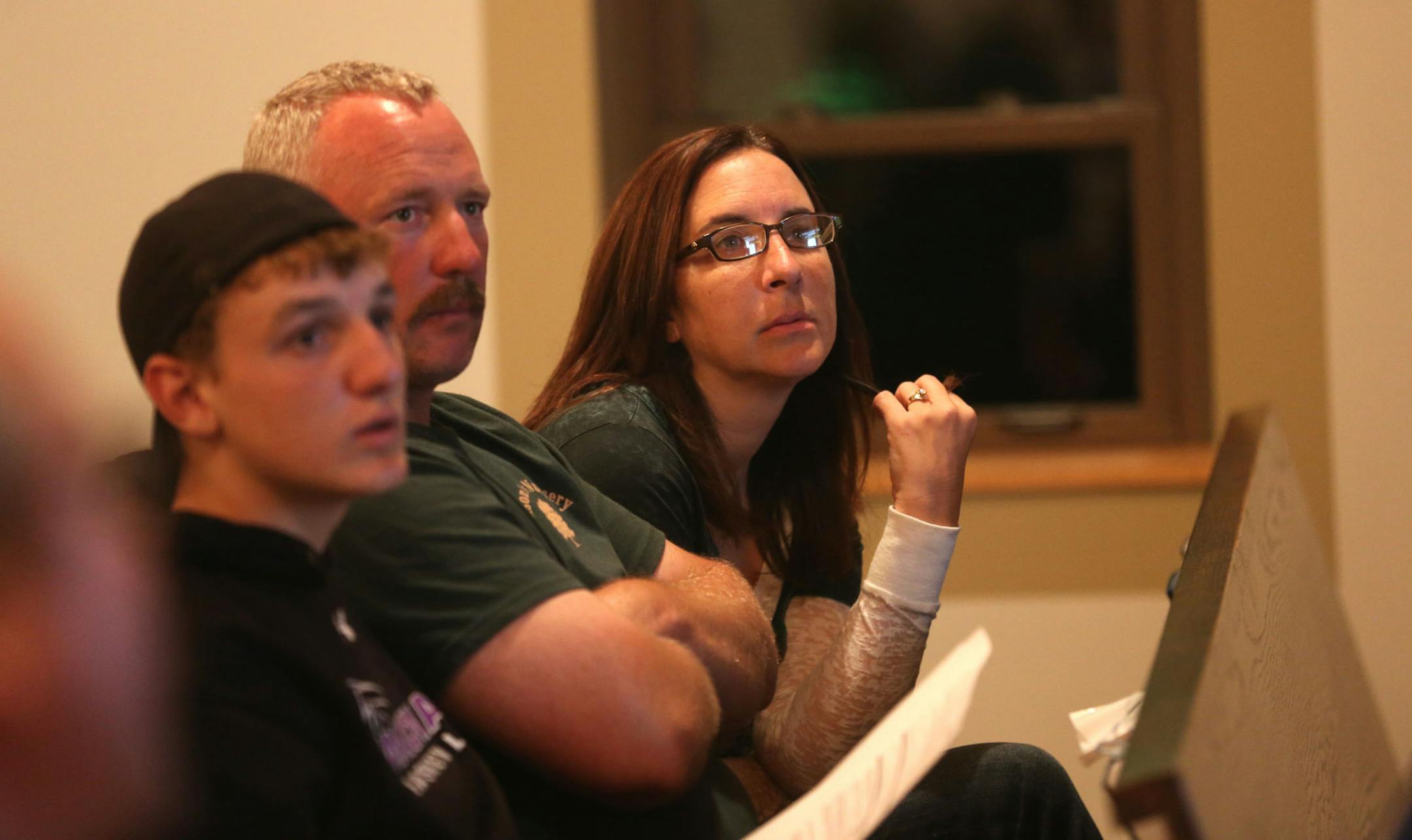 Connor Mielke, 15, and his parents Steven and Jennifer listened to speaker Gordy Pehrson , traffic safety coordinator for the department of public safety, during the Point of Impact free seminar or parents with teens who are about to drive at the Shepherd of the Hill Presbyterian in Chaska, Wednesday September 25, 2013. ] (KYNDELL HARKNESS/STAR TRIBUNE) kyndell.harkness@startribune.com