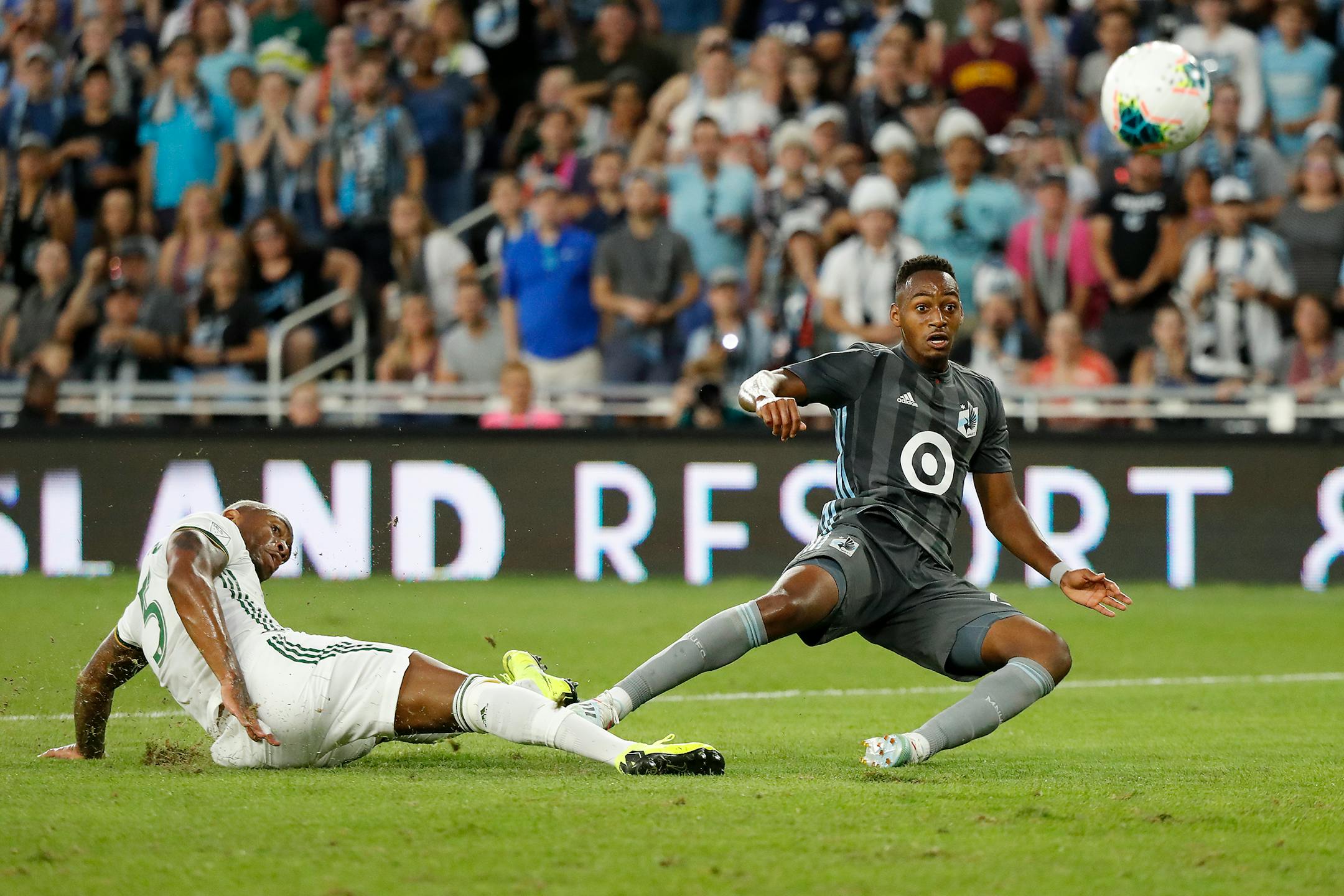 Loons forward Mason Toye scored a goal as Portland defender Claude Dielna defended during the second half.