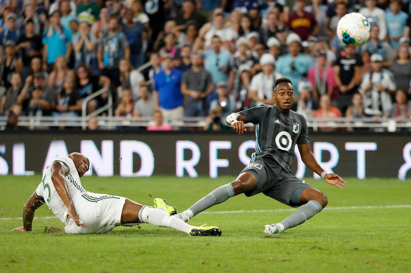 Loons forward Mason Toye scored a goal as Portland defender Claude Dielna defended during the second half.