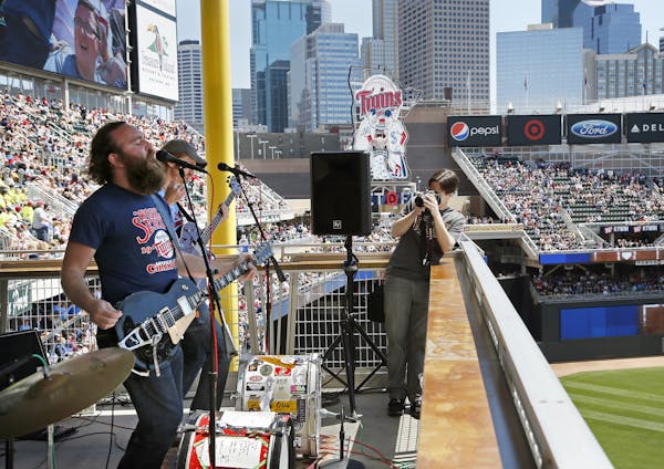 The Twins are featuring local bands in a big way this season. Here, 4onthefloor performs from the 3rd deck during the Twins White Sox game Wednesday a