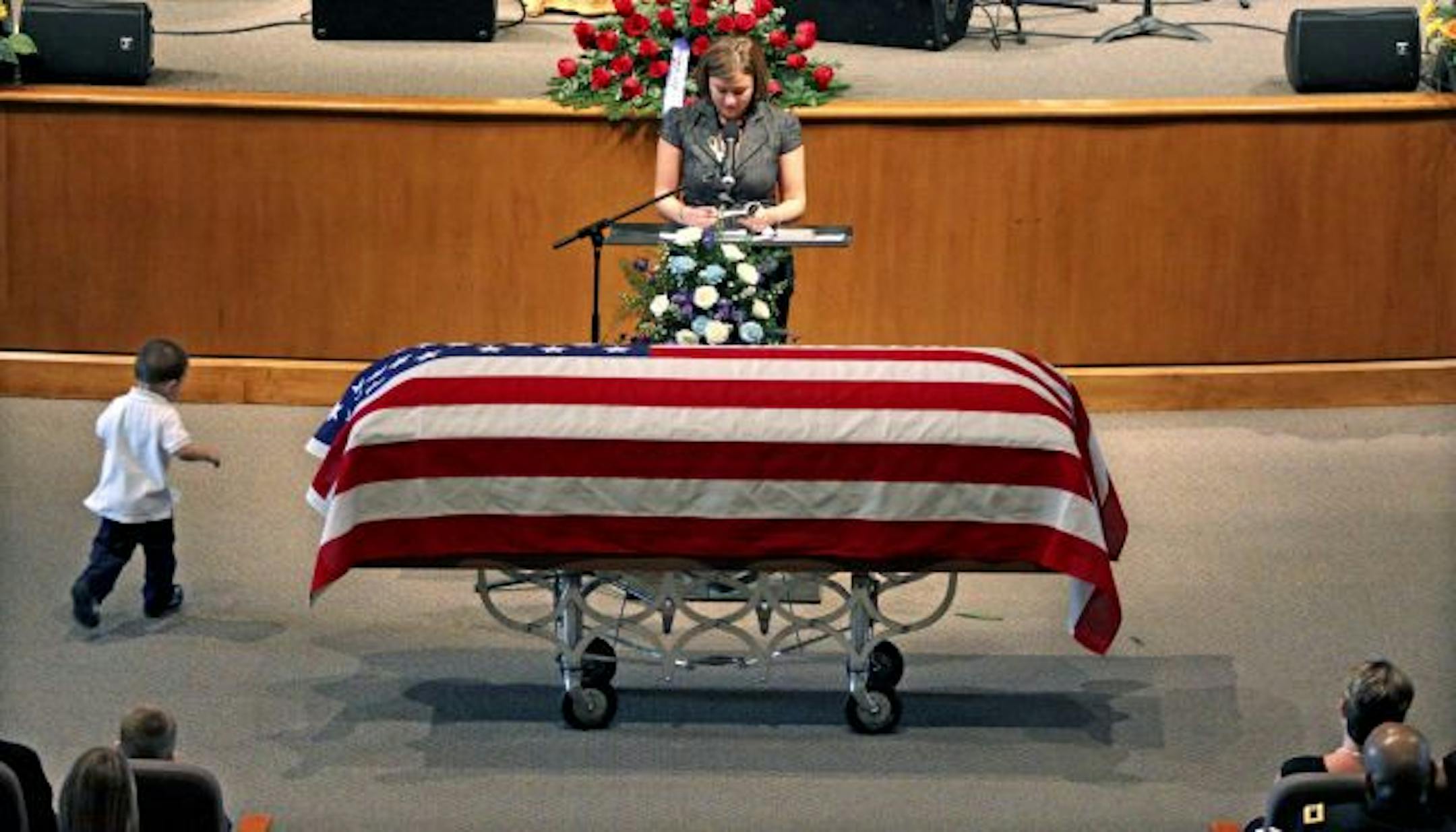 Dellona Selge speaks of her husband, Army Staff Sgt. Todd Selge, during his funeral service at Hosanna Lutheran Church in Lakeville.