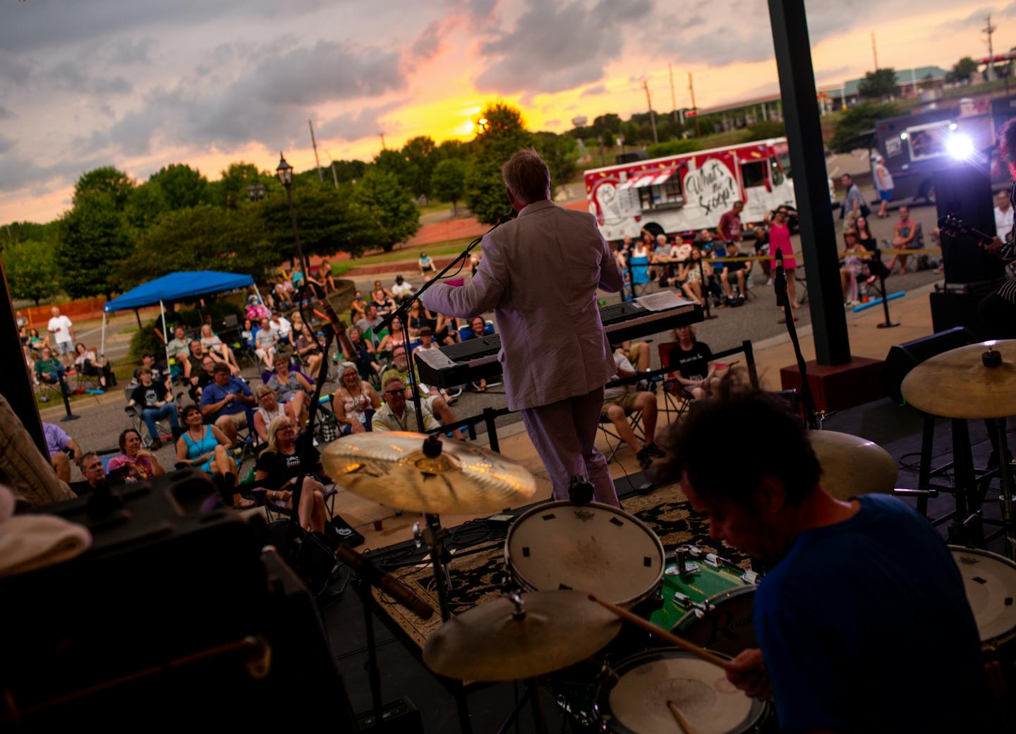 [The Suburbs performed a concert in the parking lot of St. Michael Cinema, photographed Saturday evening] NICOLE NERI ¥ The Suburbs performed a parking lot concert meant to let fans maintain social distancing outside of St. Michael Cinema in St. Michael Saturday, July 18, 2020. Fans brought their own lawn chairs and were given pool noodles to help measure six feet of distance.