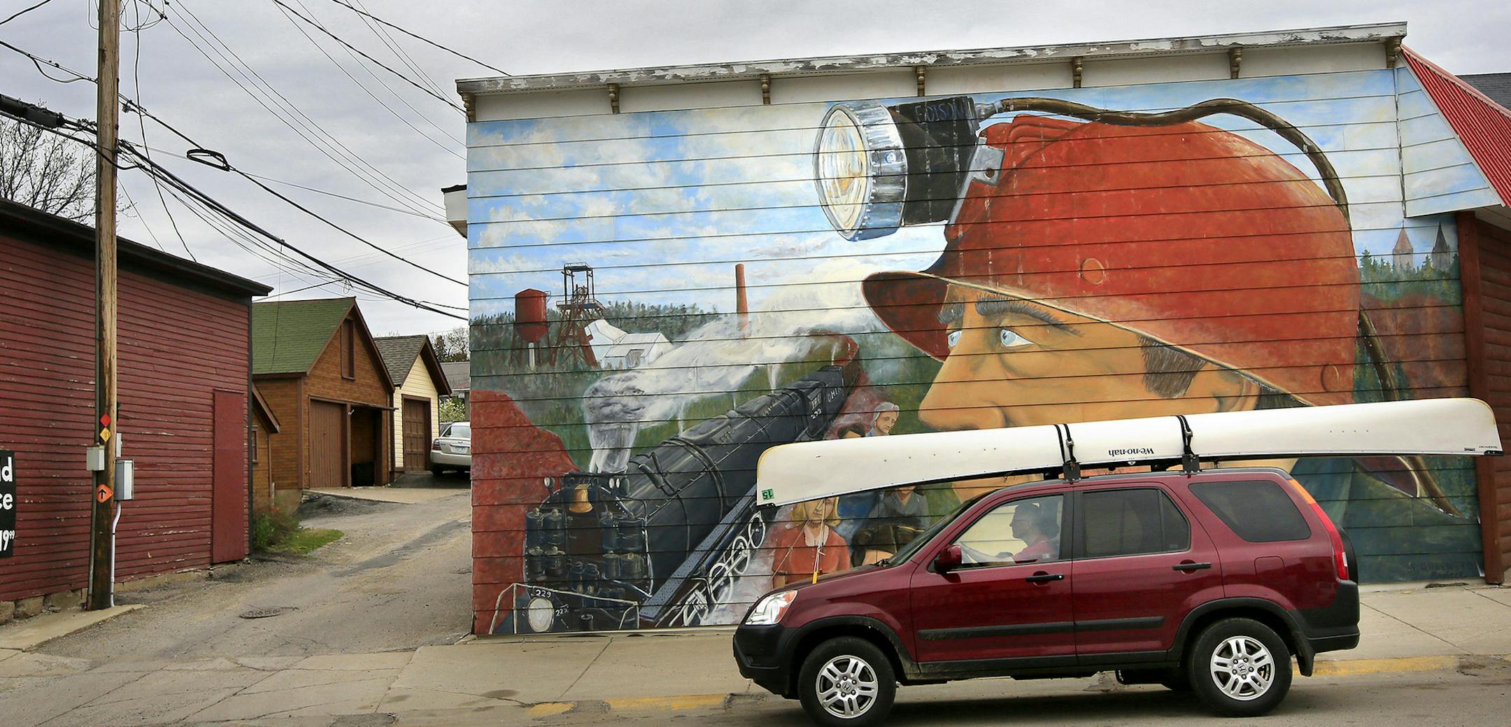 Not since the battle of 1978 to designate the BWCA as a wilderness area has the town of Ely been so divided. This time it's the possibility of Copper/Nickel mining and the promised jobs it brings -vs- the fear that mining so close to the BWCA could contaminate the water. Here, It's not hard to find the contrast of Ely past and present. This mural painted by artist Bill Defenbaugh is across the street from Piragis Northwoods Company that has catered to canoeists since 1979. ] BRIAN PETERSON ¬