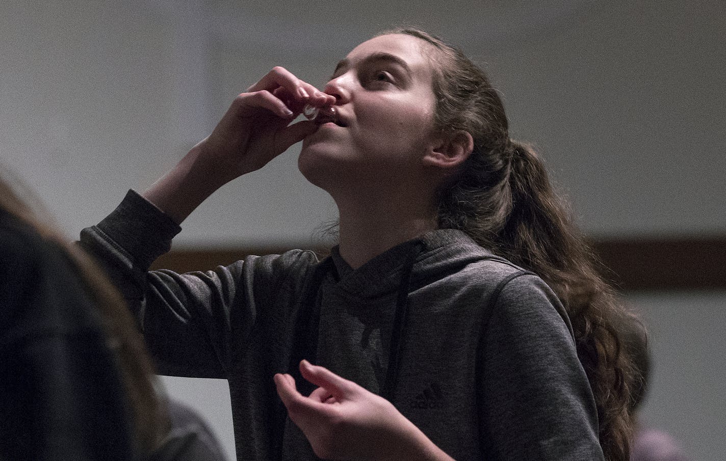 Laura Landini, 14, received communion at Transfiguration Lutheran Church in Bloomington during a Wednesday service. ] CARLOS GONZALEZ &#x2022; cgonzalez@startribune.com - April 19, 2017, Bloomington, MN, Transfiguration Lutheran Church,