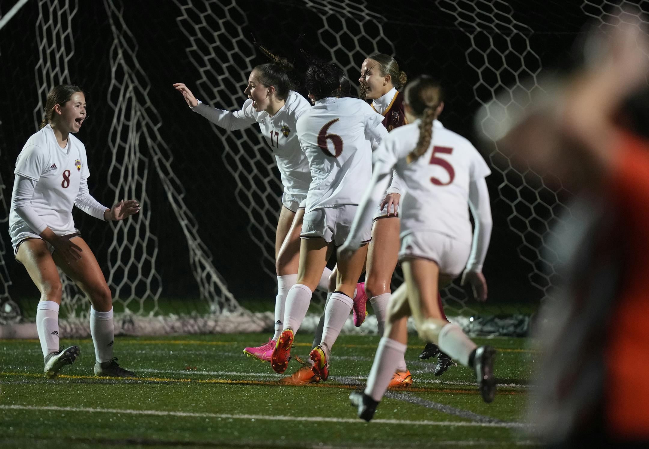 Maple Grove celebrates its 2-1 win over White Bear Lake.