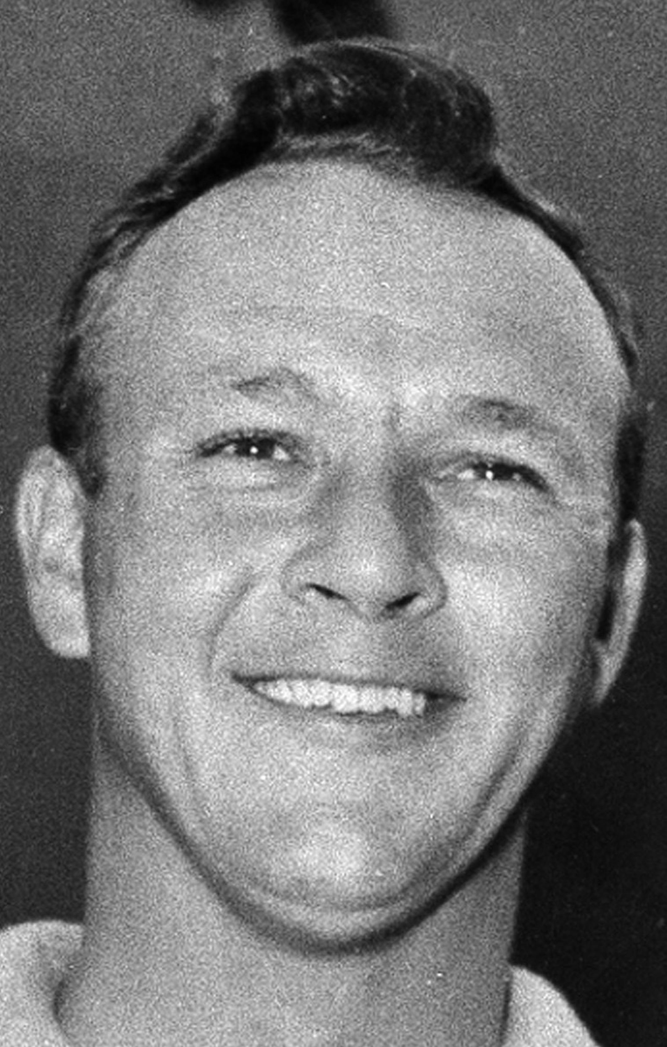 File-This July 15, 1961, file photo shows Arnold Palmer smiling with his trophy and medal after winning the British Open Golf Championship by a single stroke at Royal Birkdale course in Birkdale, Lancashire, England. Palmer, who made golf popular for the masses with his hard-charging style, incomparable charisma and a personal touch that made him known throughout the golf world as "The King," died Sunday, Sept. 25, 2016, in Pittsburgh. He was 87. (AP Photo, File) ORG XMIT: MIN2016100118491613