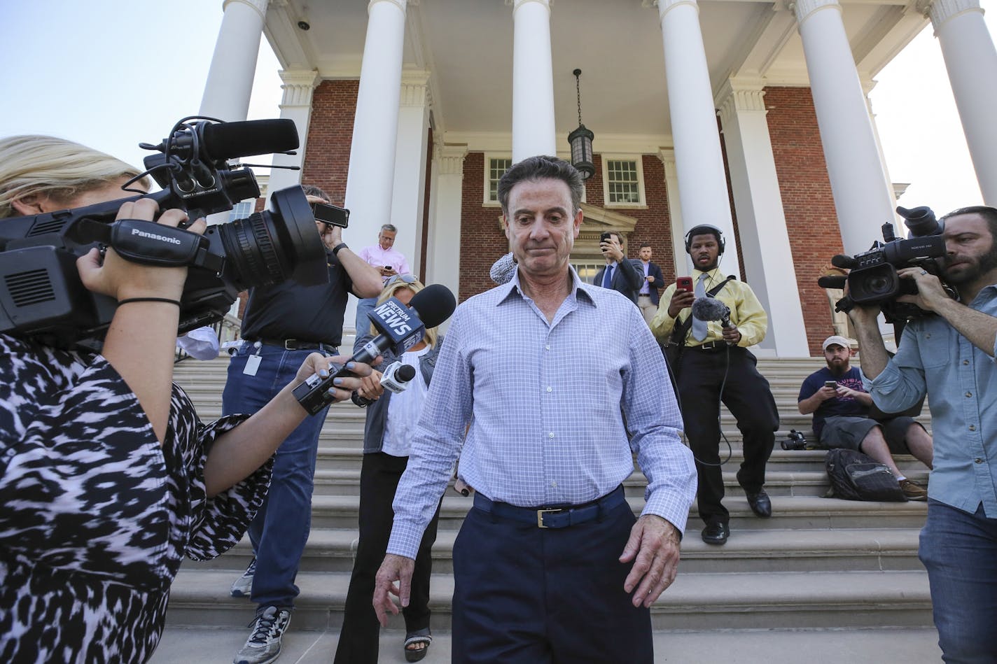 Rick Pitino leaves Grawemeyer Hall after having a meeting with the university's interim president Greg Postel last September