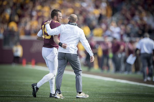 Minnesota's Head Coach P. J. Fleck walked off the field quarterback Conor Rhoda during the third quarter as the Gophers took on Maryland at TCF Bank S