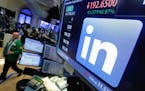 The LinkedIn logo on a screen at the post where it trades on the floor of the New York Stock Exchange. LinkedIn is laying off nearly 1,000 employees, 