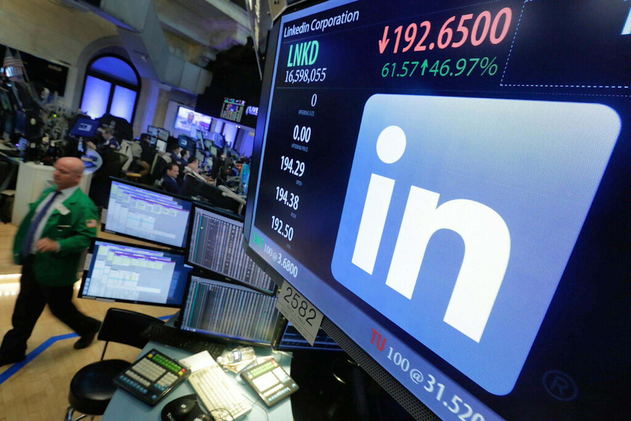The LinkedIn logo on a screen at the post where it trades on the floor of the New York Stock Exchange. LinkedIn is laying off nearly 1,000 employees, or approximately 6% of its global workforce.