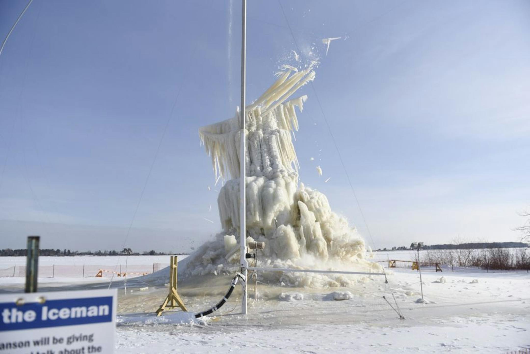 The Lake Superior Ice Project, made by Roger Hanson, known as the "Ice Man" for his sprawling backyard ice structures, collapses in Superior, Wis., Feb. 3, 2015. On Tuesday, the 66 foot project, which took three months of work, collapsed onto the snow-covered ground.