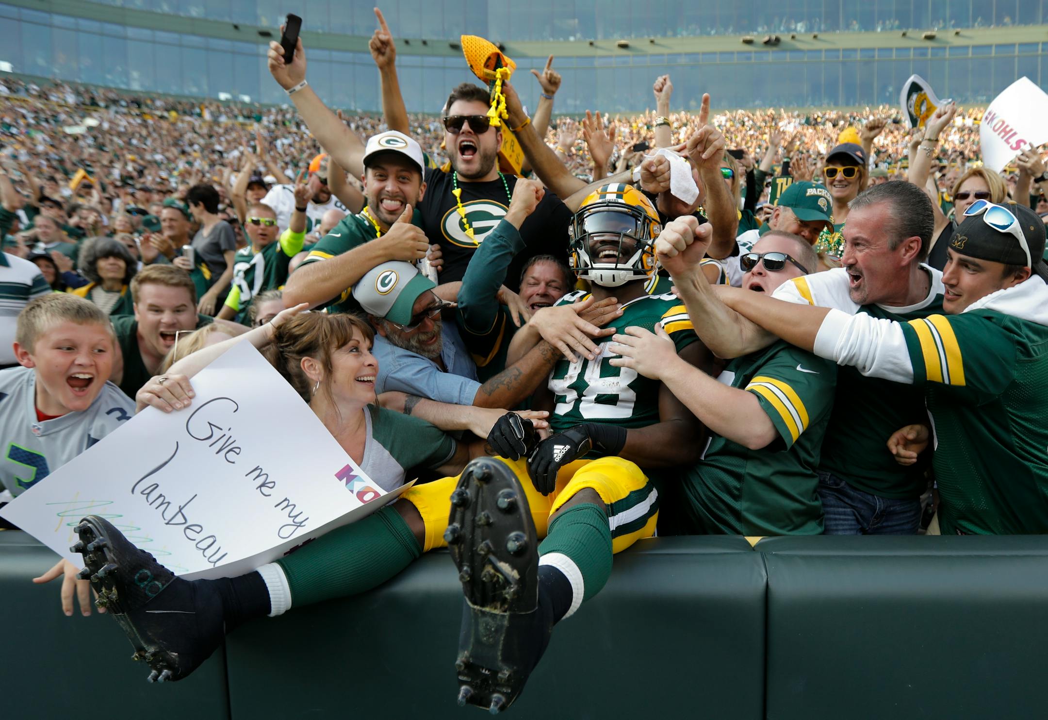 the Packers' Ty Montgomery celebrated his touchdown run with a Lambeau Leap into the crowd during the second half of a 17-9 victory over the Seahawks on Sunday.