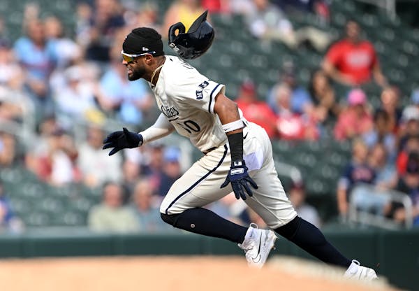 Minnesota Twins center fielder Willi Castro's (50) helmet flies off as he rounds the bases after hitting a triple against the New York Mets in the bot