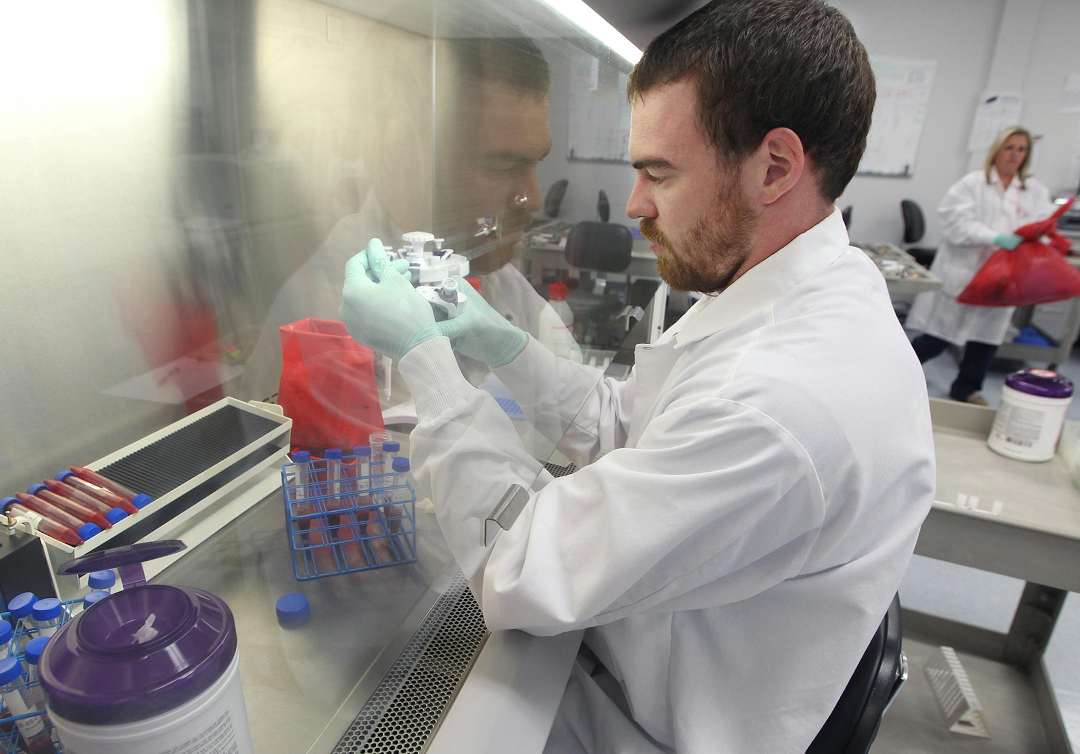 Josh Owens, a bio-repository technician, processes a blood sample, post transplant, at the Be the Match repository in New Brighton. Tuesday, July 21, 2015 in New Brighton, MN. ] (ELIZABETH FLORES/STAR TRIBUNE) ELIZABETH FLORES • eflores@startribune.com
