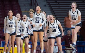 Minnetonka players celebrate their 67-49 win over St. Michael-Albertville in the Class 4A semifinals Thursday night.