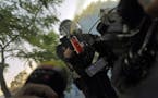 Minnesota State Patrol officers spray journalists with pepper spray and fire rubber bullets while they are working, despite their exemption from the c