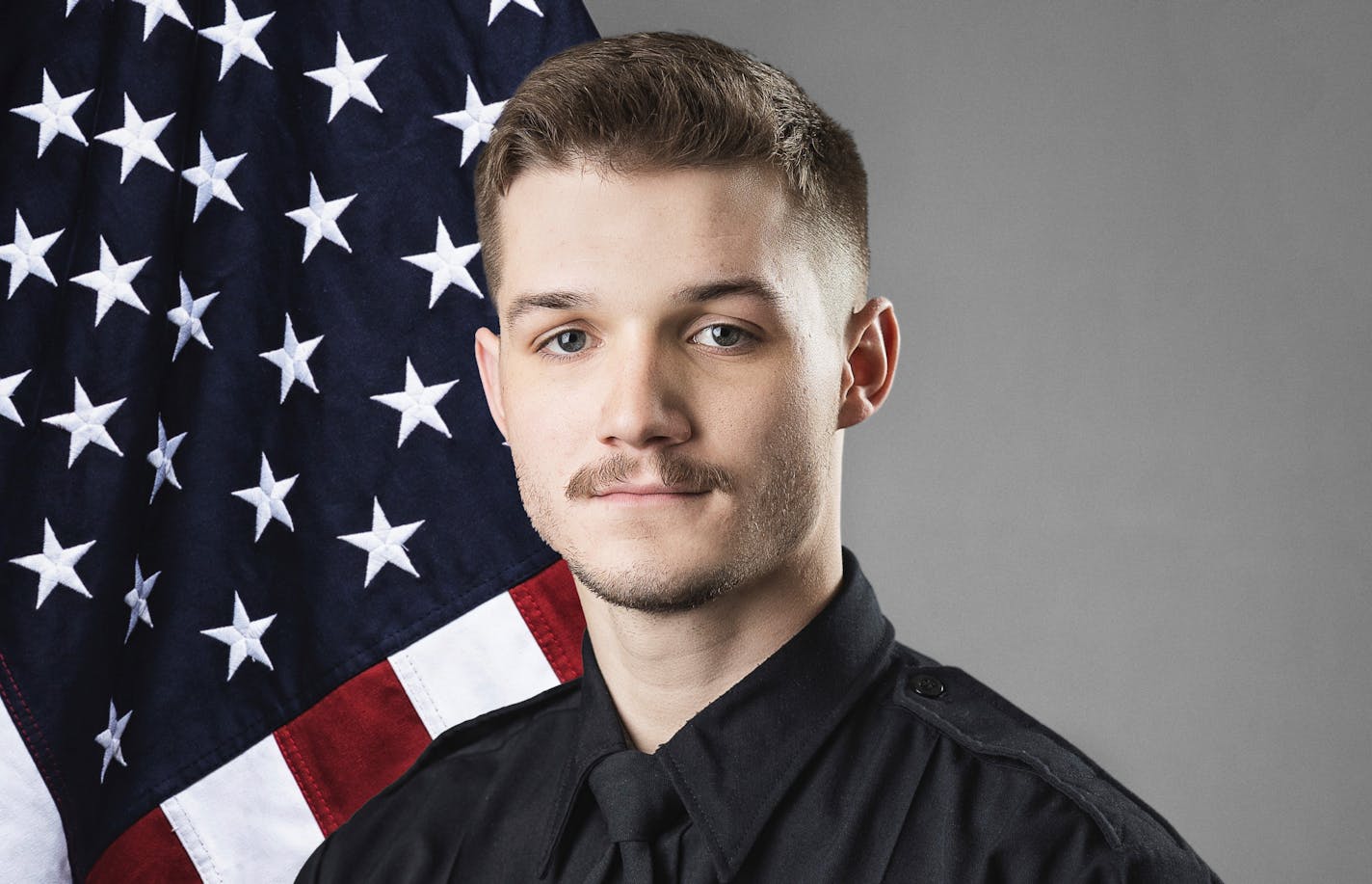 This photo provided by The City of Fargo, N.D., on Saturday, July 15, 2023 shows police officer Jake Wallin. On Saturday, Fargo's police chief said a gunman opened fire on police and firefighters as they responded to a traffic crash in North Dakota. One officer, Wallin, was killed and two others were wounded before a fourth officer killed him. (The City of Fargo via AP)