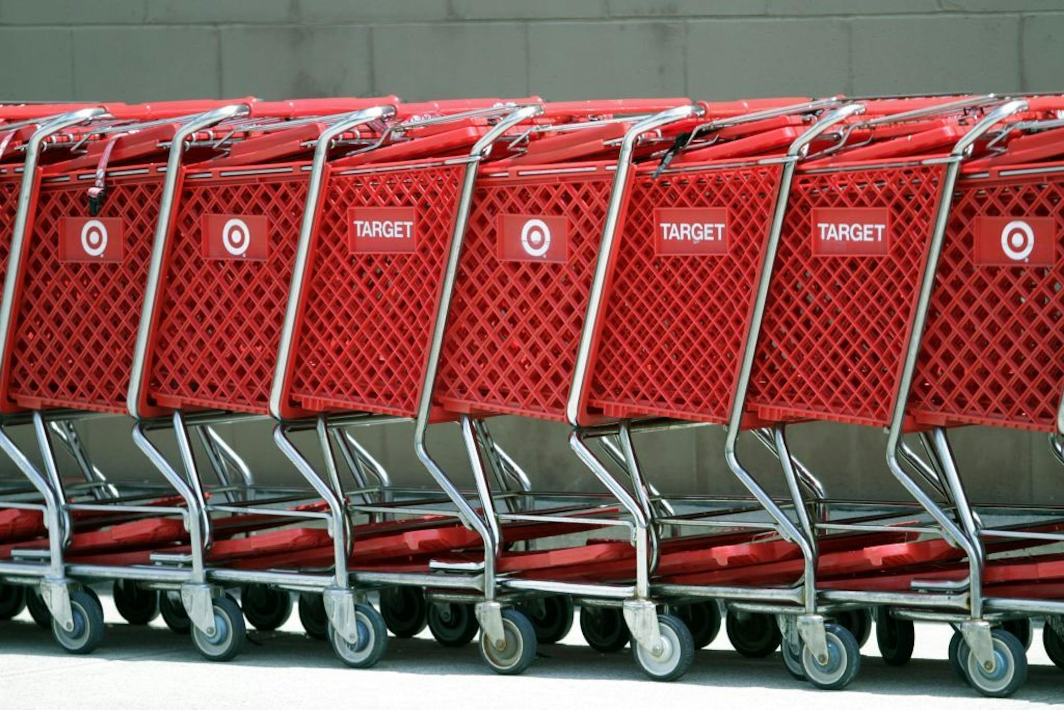 Shopping carts sit parked outside a Target store.