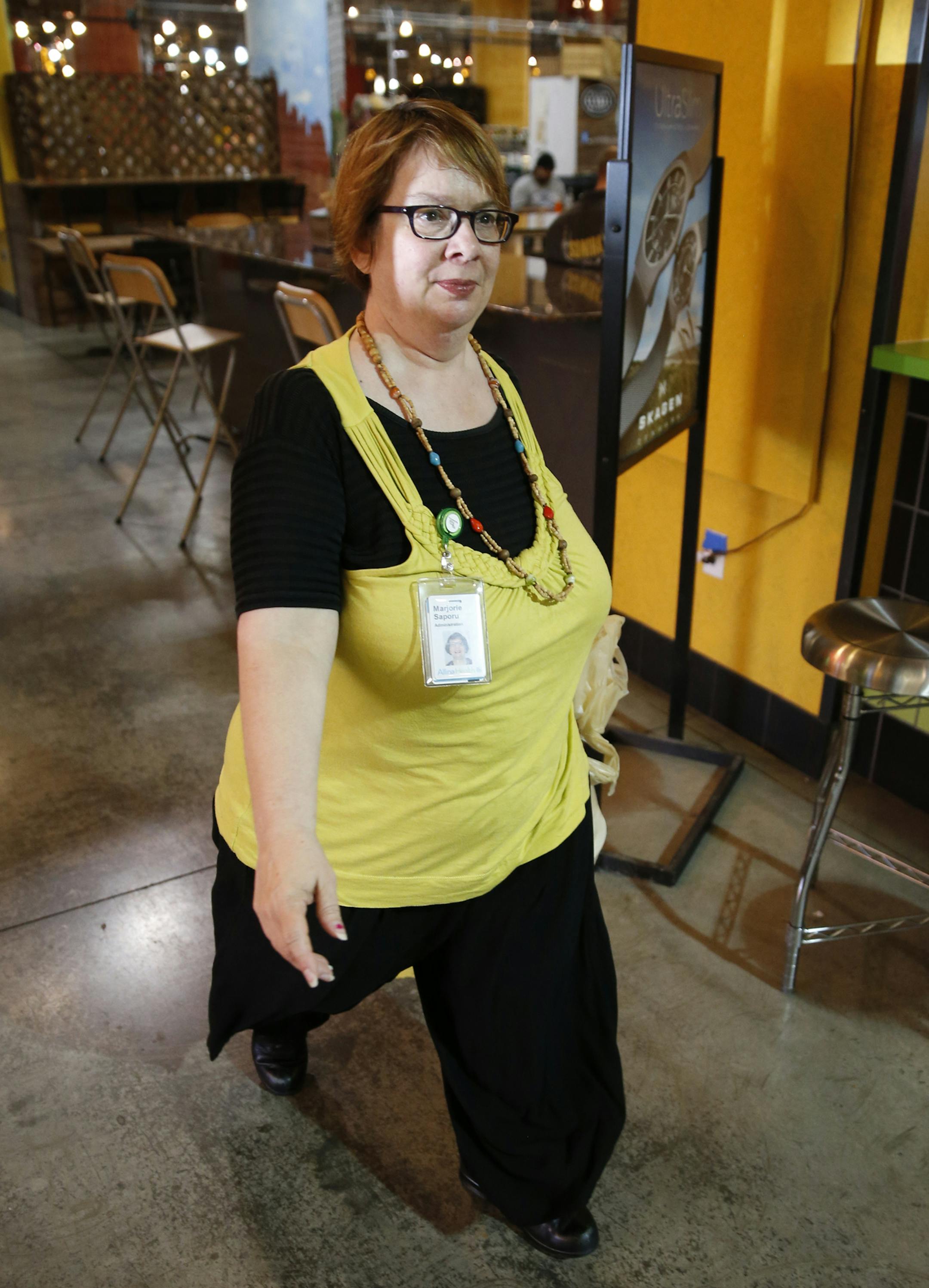 Marjorie Saporu has added simple fitness routines to her day at work to deal with her weight and osteoarthritis. She is an admin assistant at the Allina Commons building in Minneapolis. She walks 6,000 steps a day, in part with daily strolls through Midtown Market, and builds muscle around her arthritic knee.]tsong-taataarii@startribune.com ORG XMIT: MIN1308221506385620