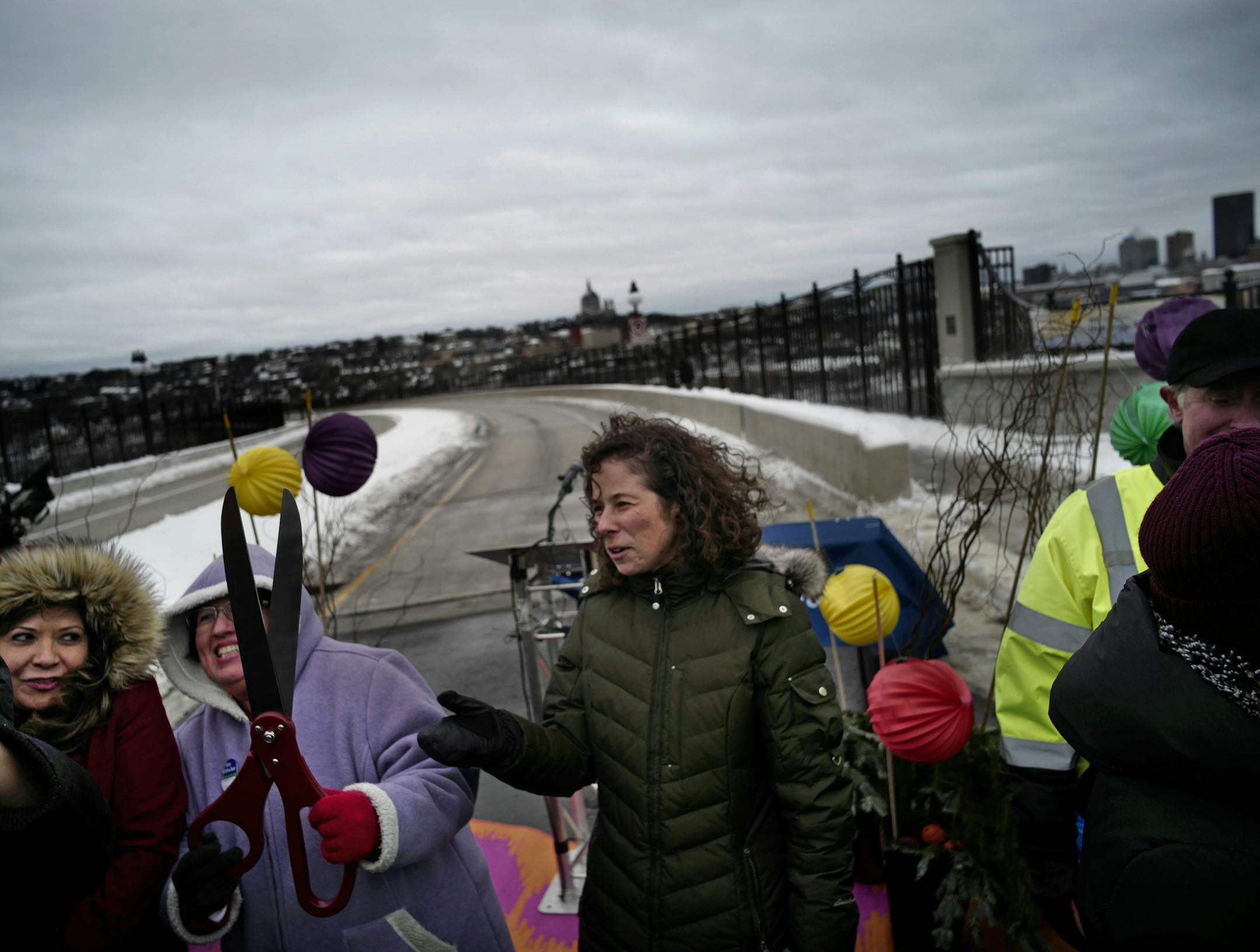 St. Paul City Council Member Rebecca Noecker, center, braved the cold and wind for Sunday's celebration at the reopening of the High Bridge.