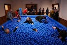 Guests played in the ball pit set up in the Swedish Institute's ballroom at "The American Swedish Institute. At Play," a multilayered exhibition that 