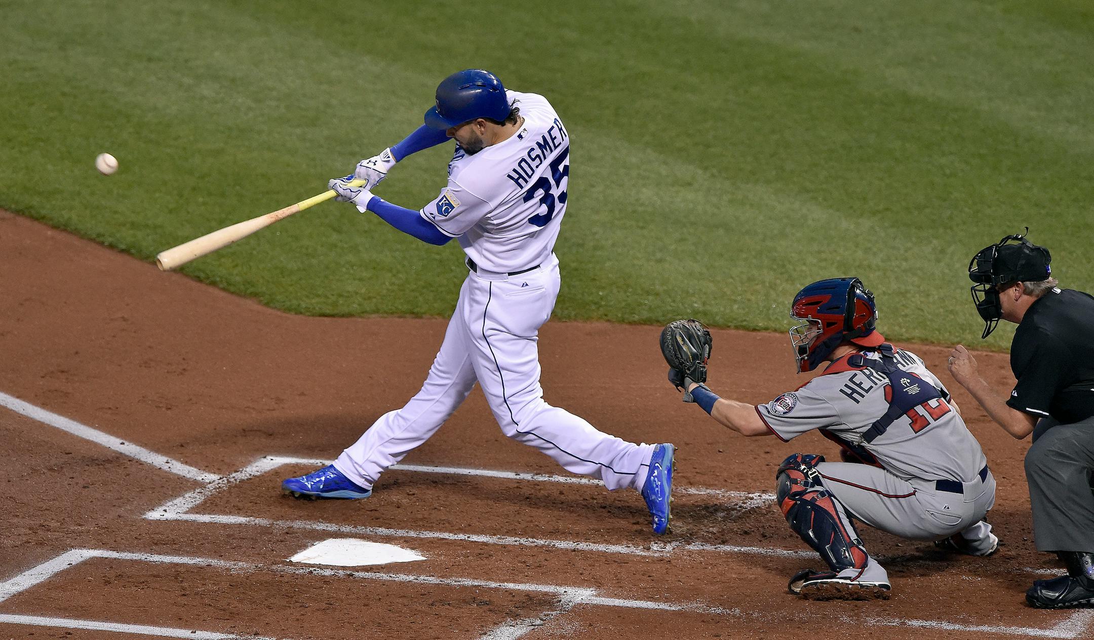 The Kansas City Royals' Eric Hosmer (35) connects on a three-run double in the first inning in front of Minnesota Twins catcher Chris Herrmann (12) on Tuesday, Sept. 8, 2015, at Kauffman Stadium in Kansas City, Mo. (John Sleezer/Kansas City Star/TNS) ORG XMIT: 1173490