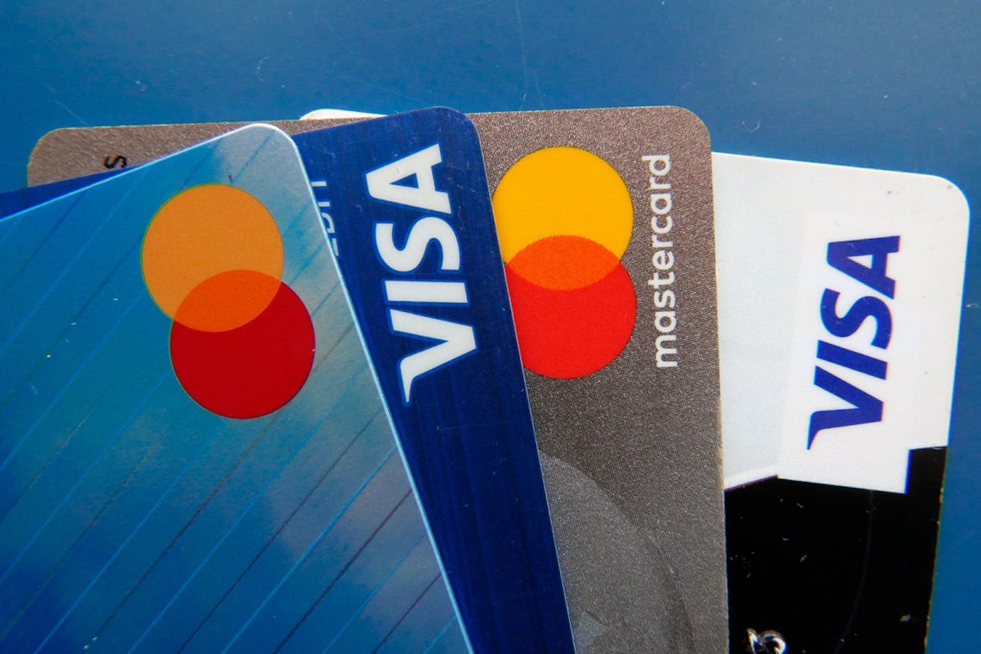 File - Credit cards as seen July 1, 2021, in Orlando, Fla. A low credit score can hurt your ability to take out a loan, secure a good interest rate, or increase a credit card spending limit. (AP Photo/John Raoux, File)